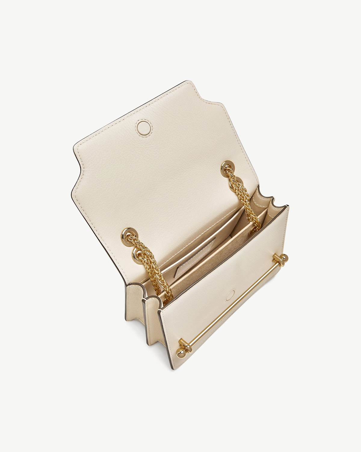Vanilla leather East/West mini bag open with gold chain strap and bar.