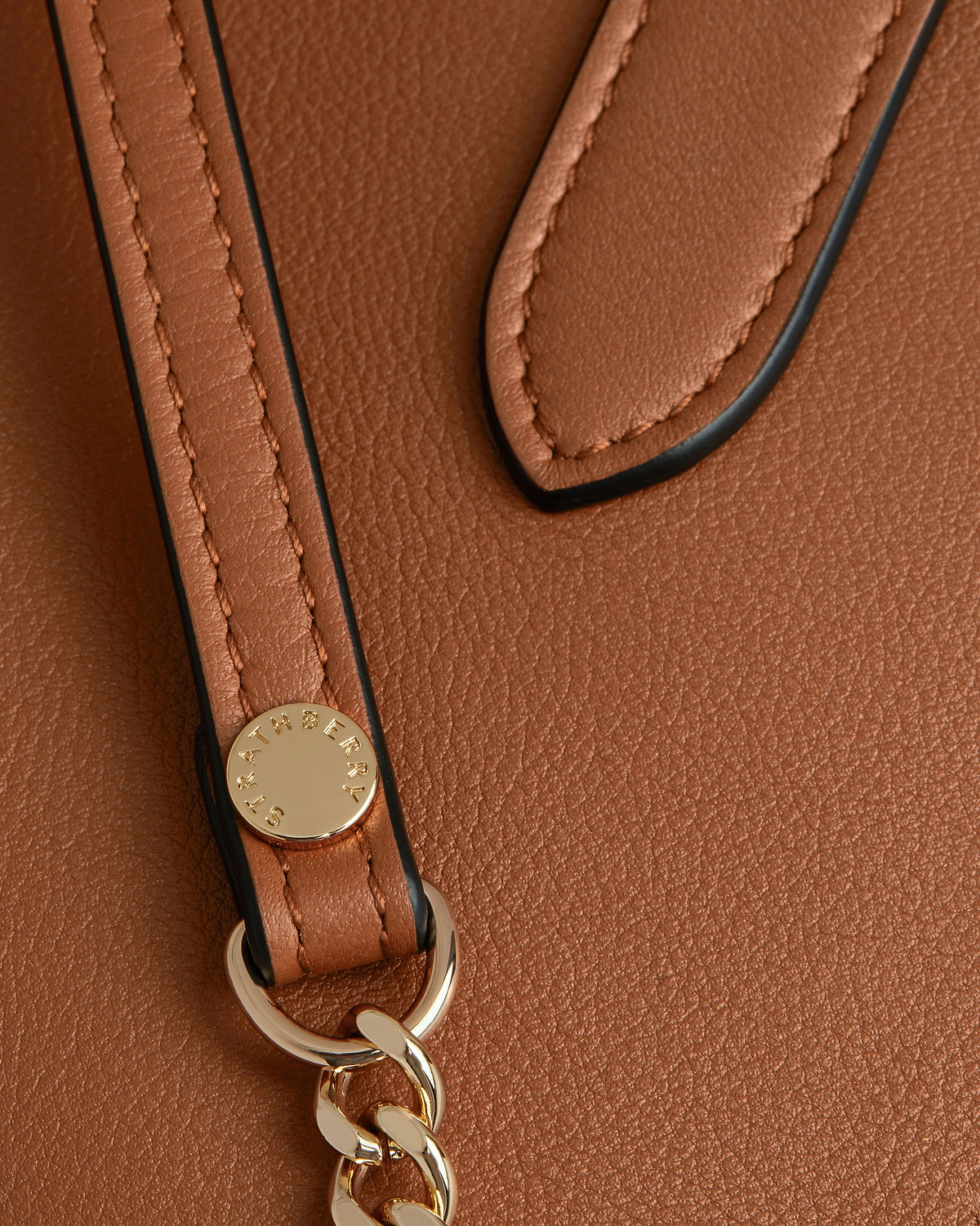 Chestnut leather nano tote strap with Strathberry stud and gold chain.