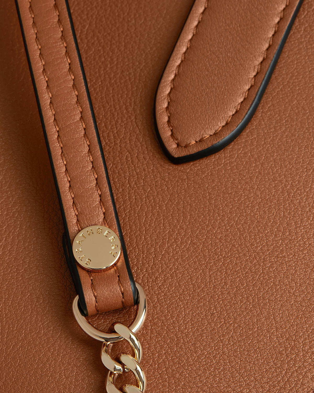 Chestnut leather nano tote strap with Strathberry stud and gold chain.