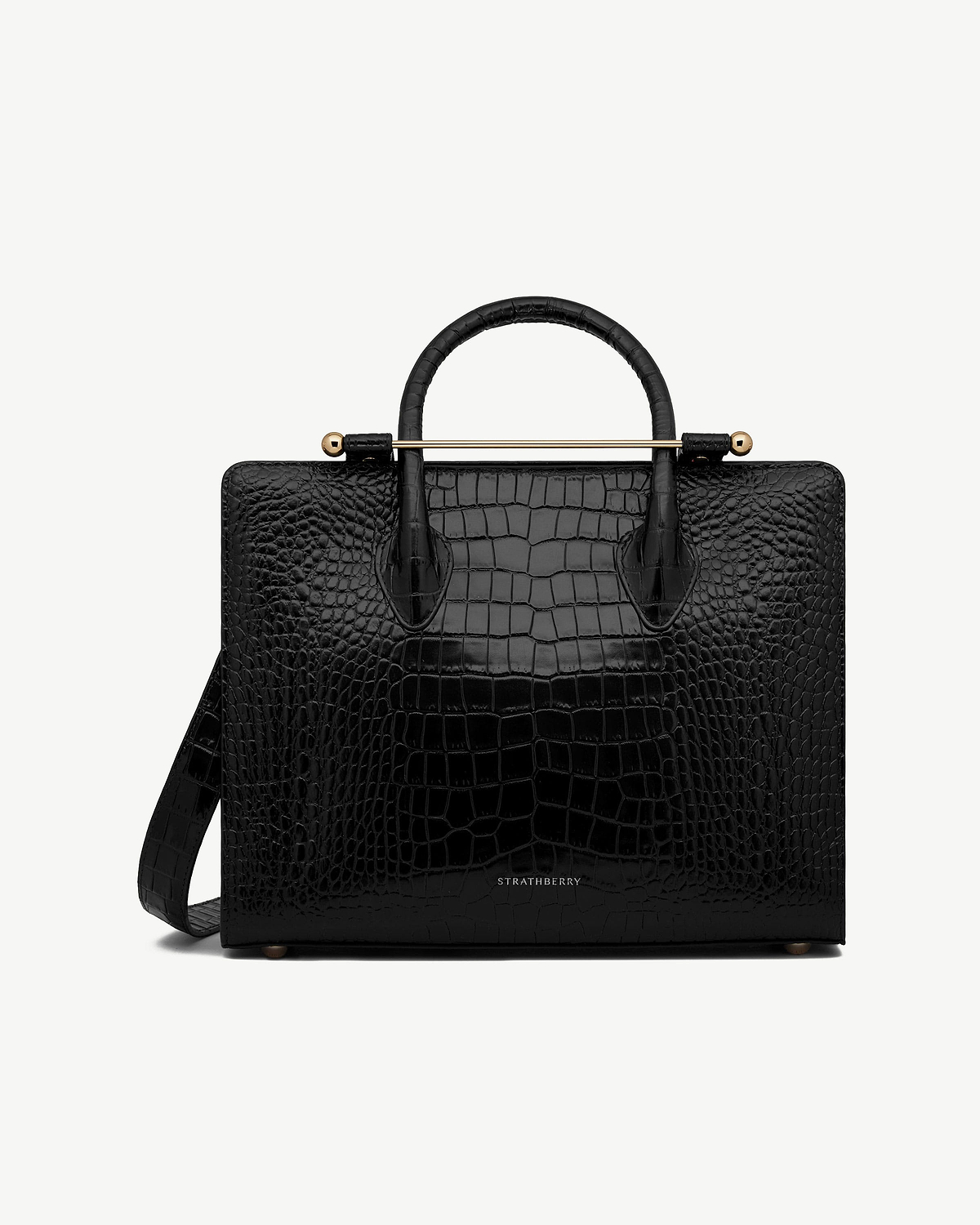 Strathberry midi tote in black croc leather with top handles and shoulder strap.