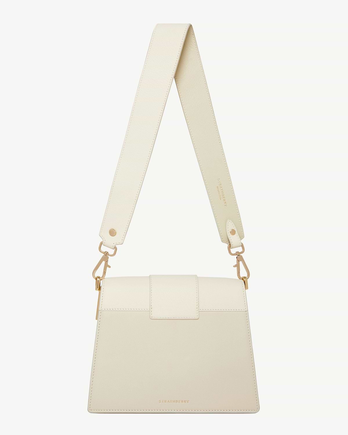 Box Crescent bag in vanilla and diamond colours with visible Strathberry logo.