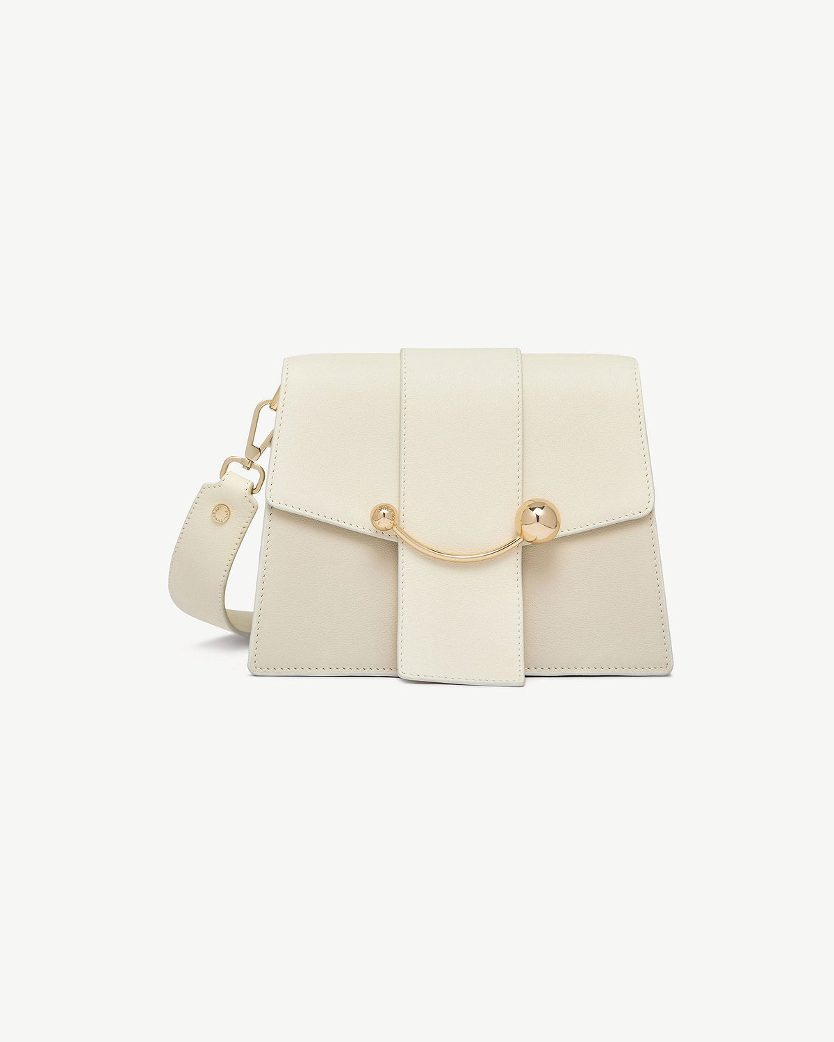 Vanilla box crescent bag with flap, curved gold bar detail and detachable strap.
