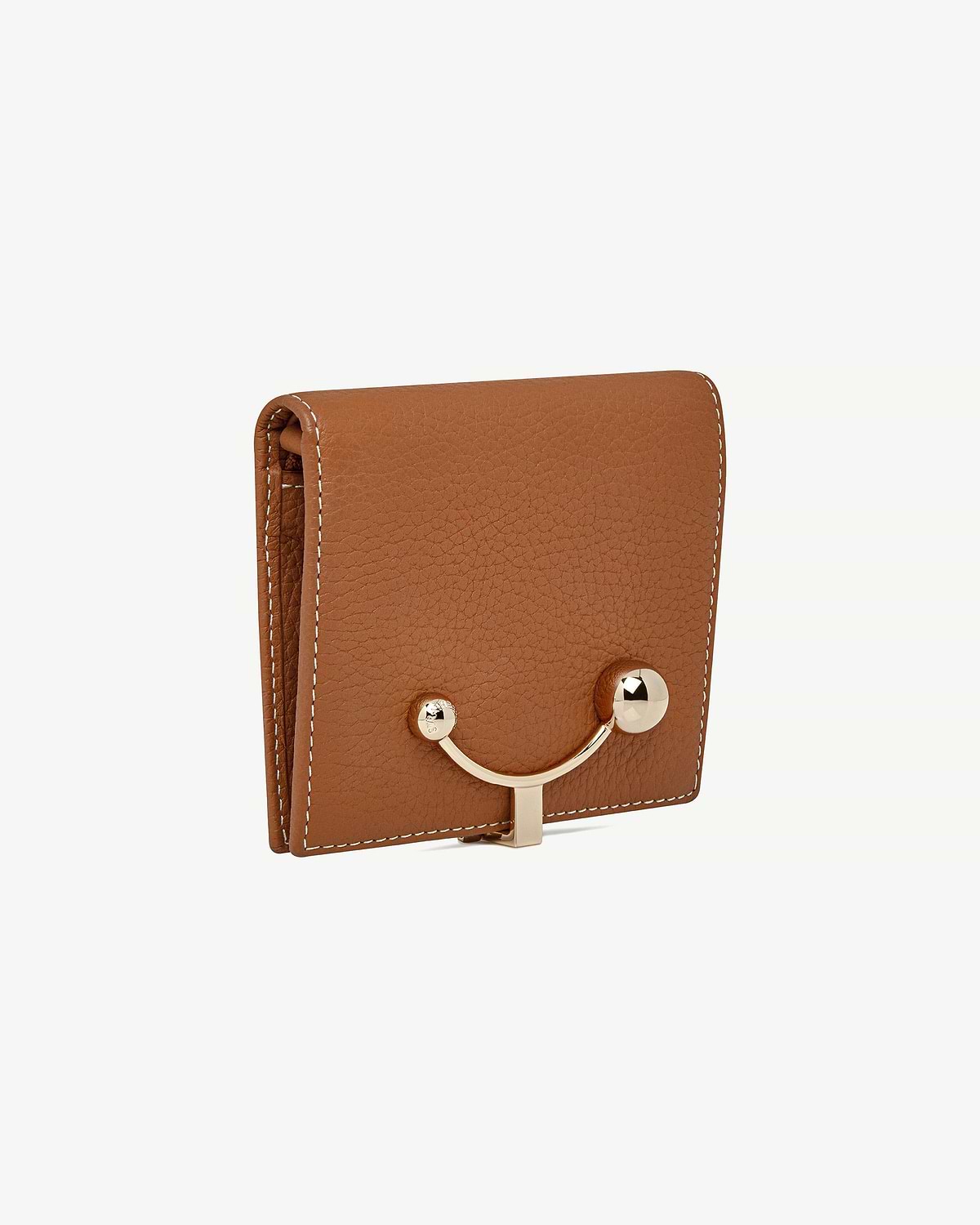 Tan crescent wallet with vanilla stitching and gold curved clasp on front