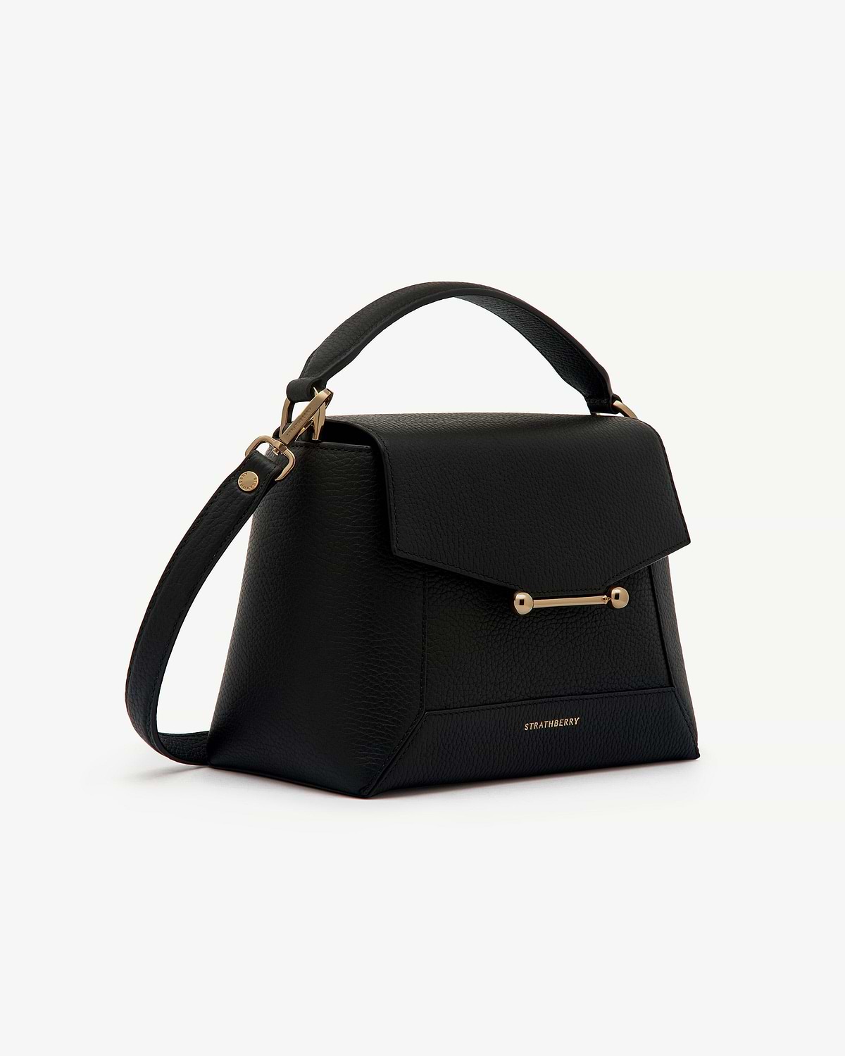 Black mosaic bag with top handle, adjustable shoulder strap, gold bar fastening, Strathberry logo.