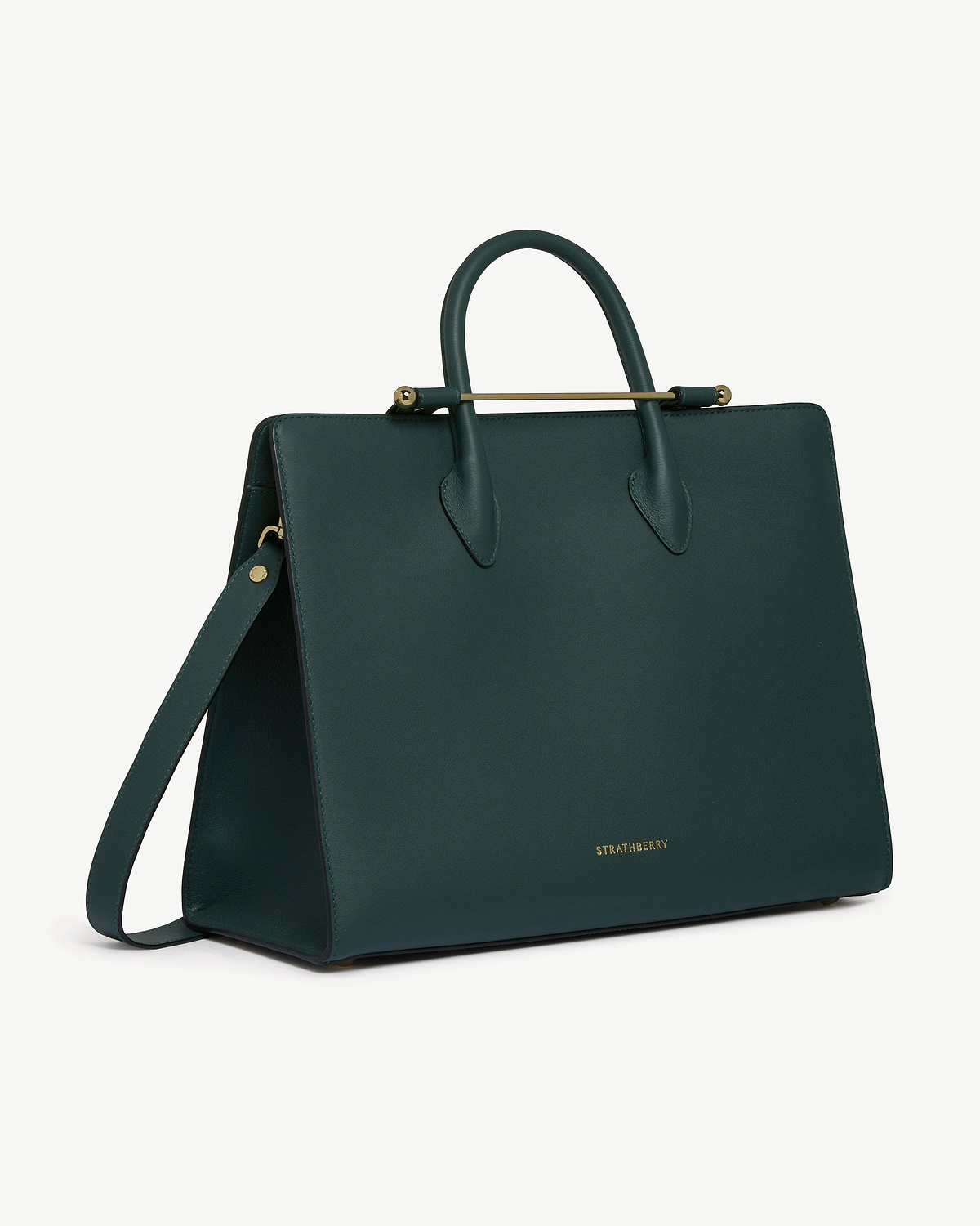 Bottle green Strathberry tote with gold bar detail, top handles and strap.