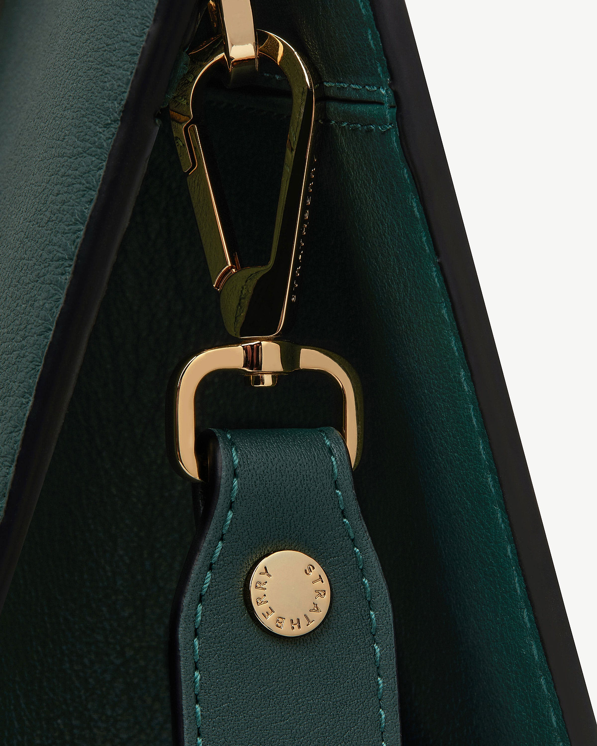 Bottle green leather tote strap with gold clasp and Strathberry stud