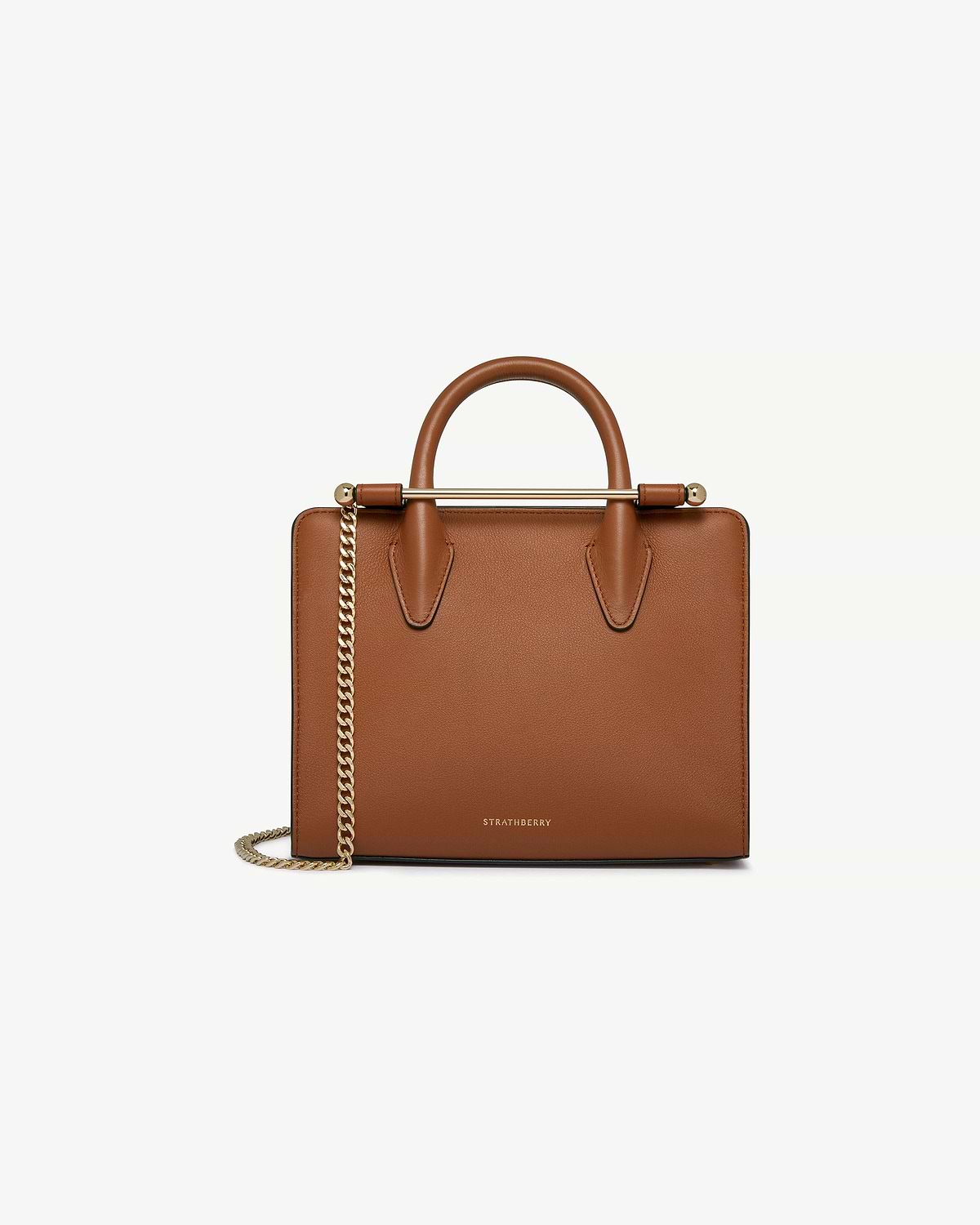 Strathberry chestnut mini tote with top handle and gold chain strap.