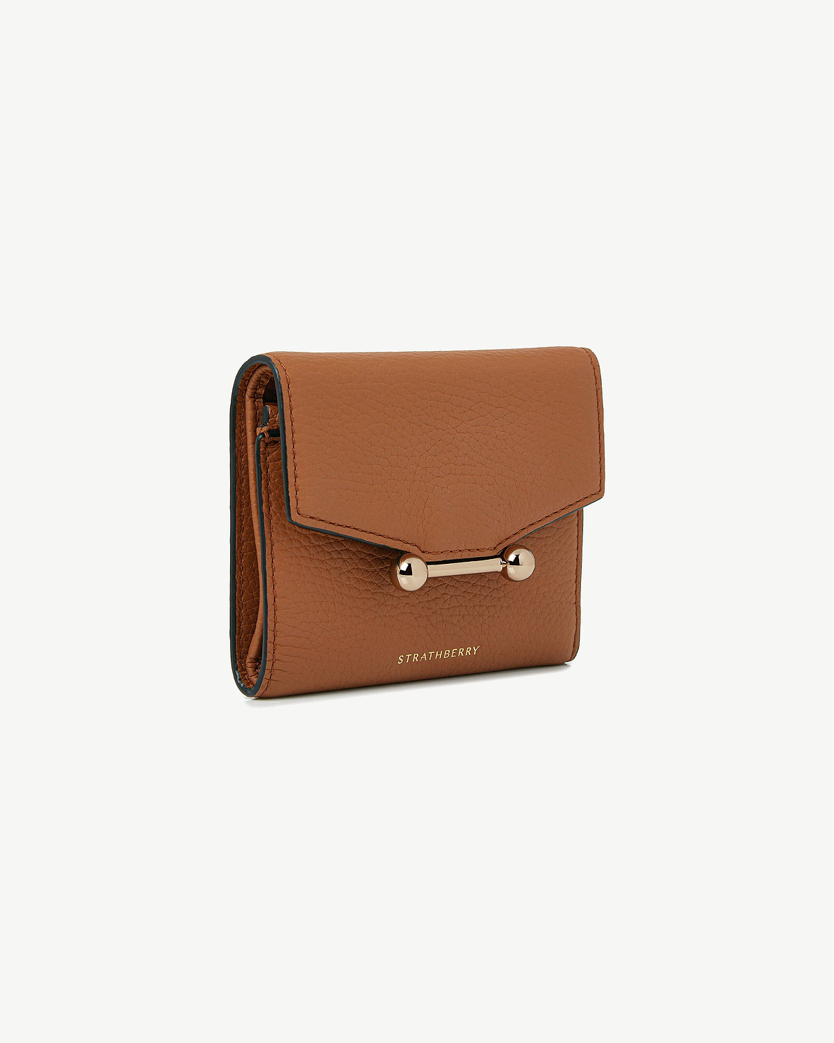Tan textured leather Mosaic trifold wallet with gold bar closure and Strathberry logo.