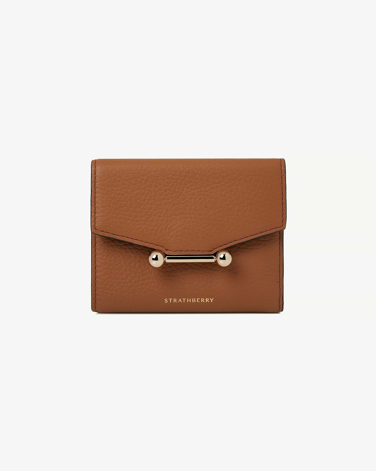 Tan trifold wallet in pebbled leather with gold bar clasp and Strathberry logo