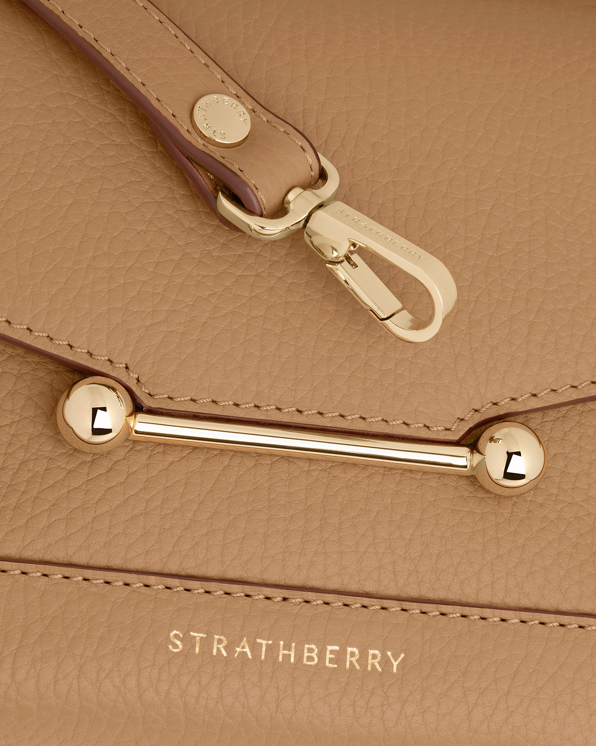 Caramel Mosaic Nano leather with gold hardware and Strathberry logo visible.