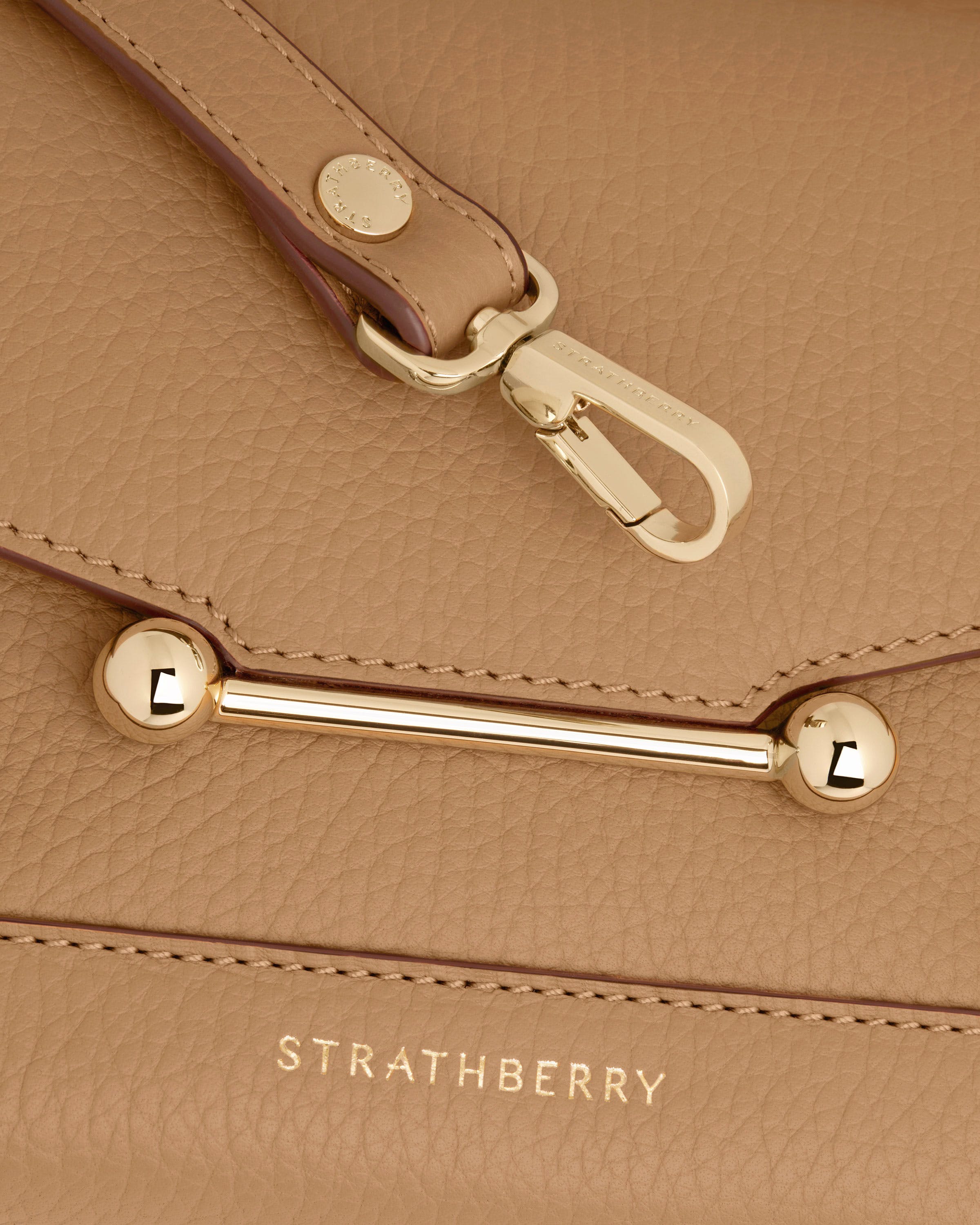 Caramel Mosaic Nano leather with gold hardware and Strathberry logo visible.