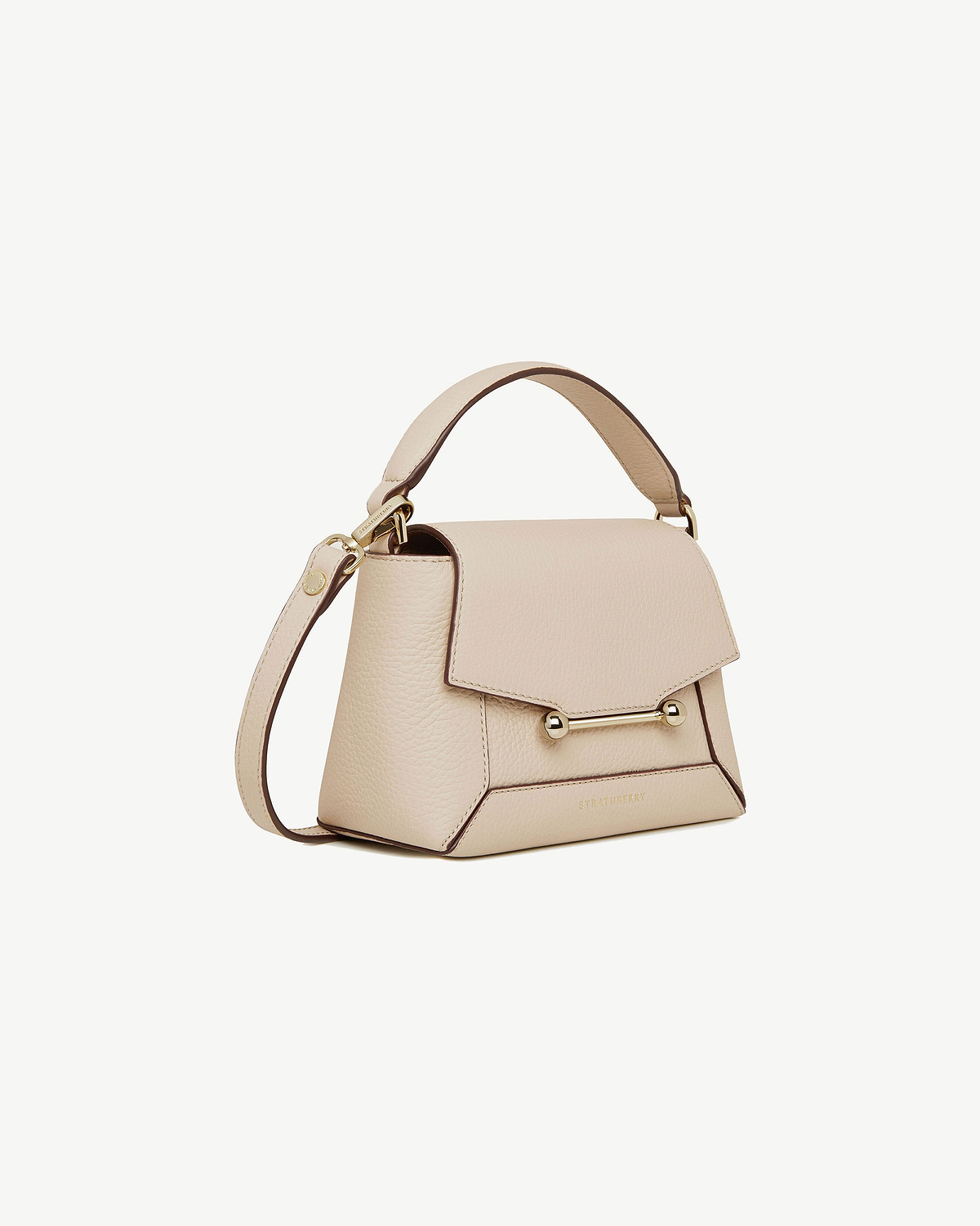 Strathberry Mosaic Nano handbag in oat with gold bar closure and top handle.