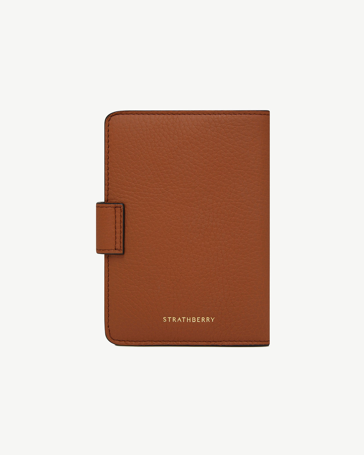 Strathberry tan passport holder in pebbled leather with tab closure