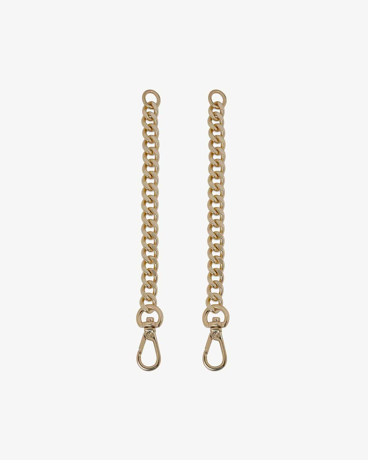 Pair of gold chain extenders with snap hooks on a white background.