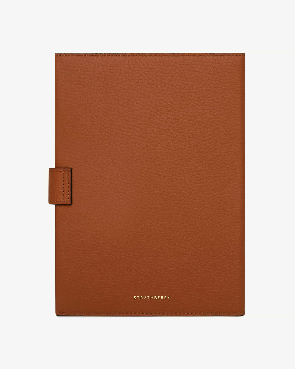 Tan leather Multrees notebook with Strathberry logo centred at bottom.