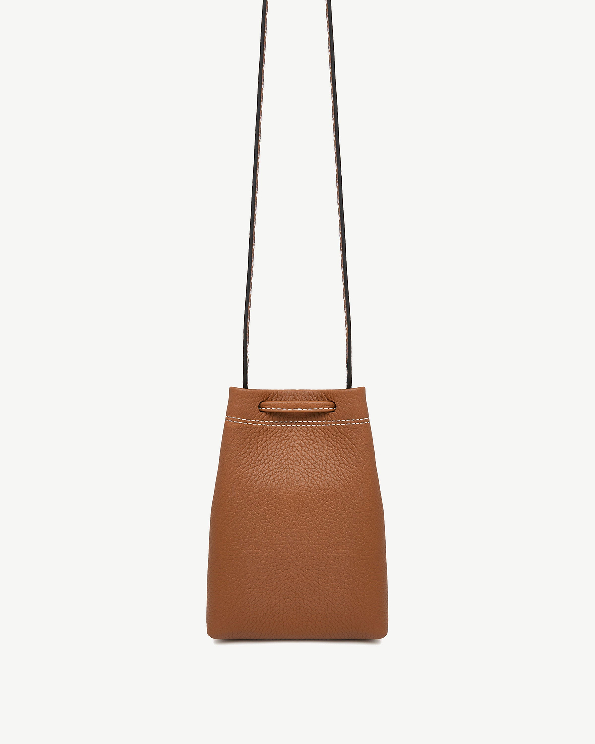 Tan pebble leather midi pouch with thin shoulder strap and white top stitching.