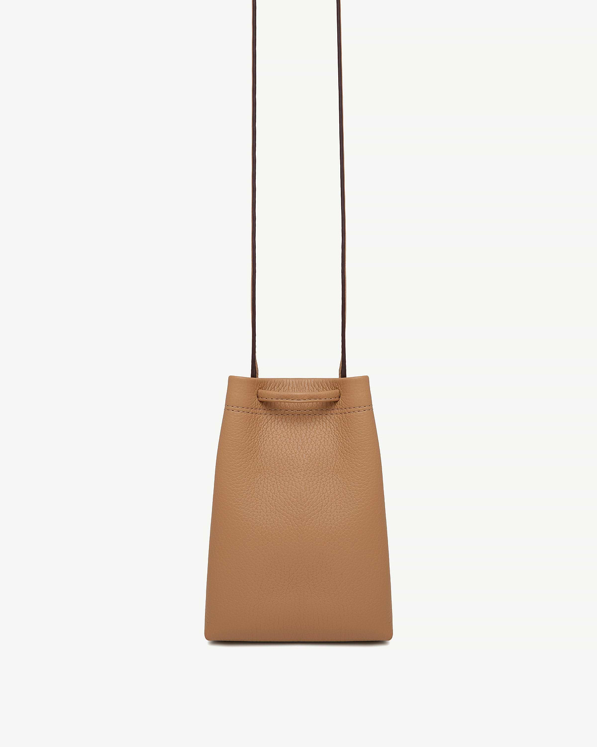 Caramel leather midi pouch with long thin straps on white background.