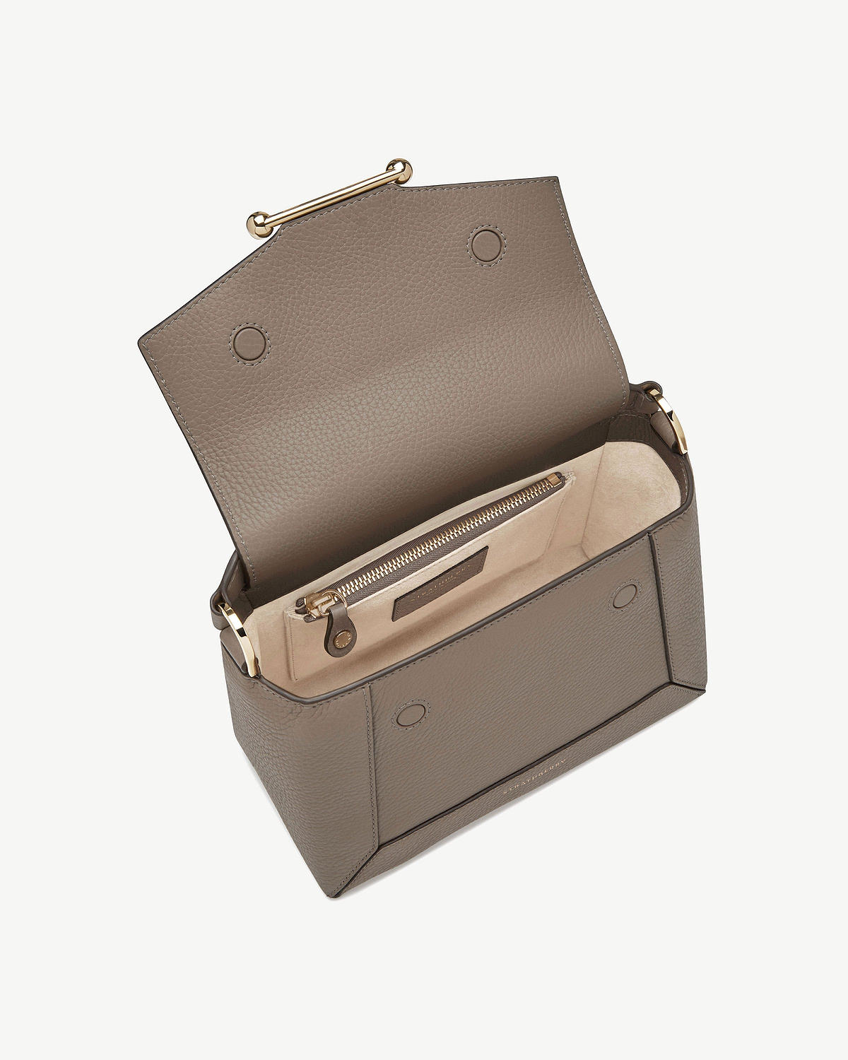 Taupe mosaic bag open showing interior zip pocket and gold hardware.
