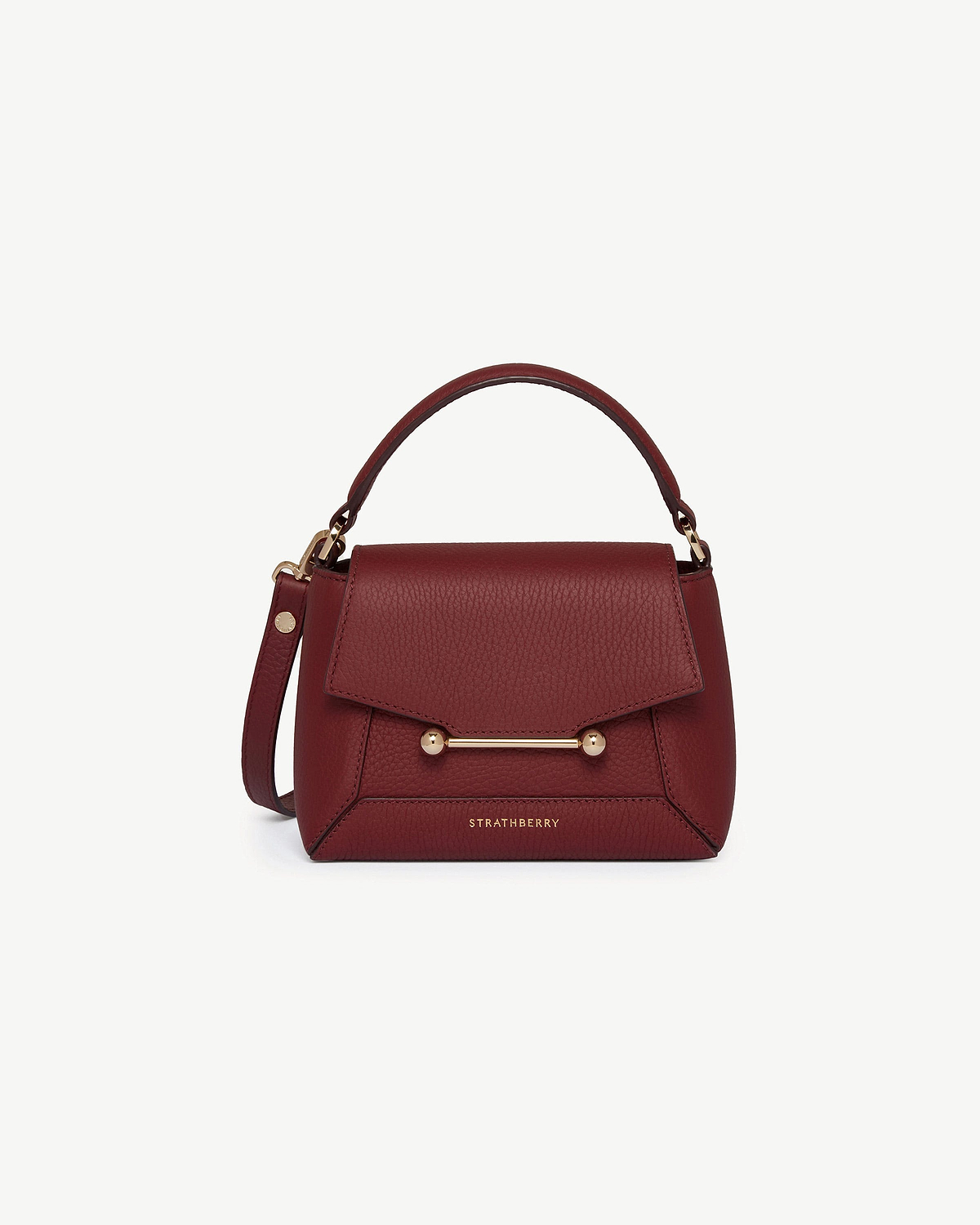 Strathberry Mosaic Nano oxblood leather top-handle bag with gold bar closure.
