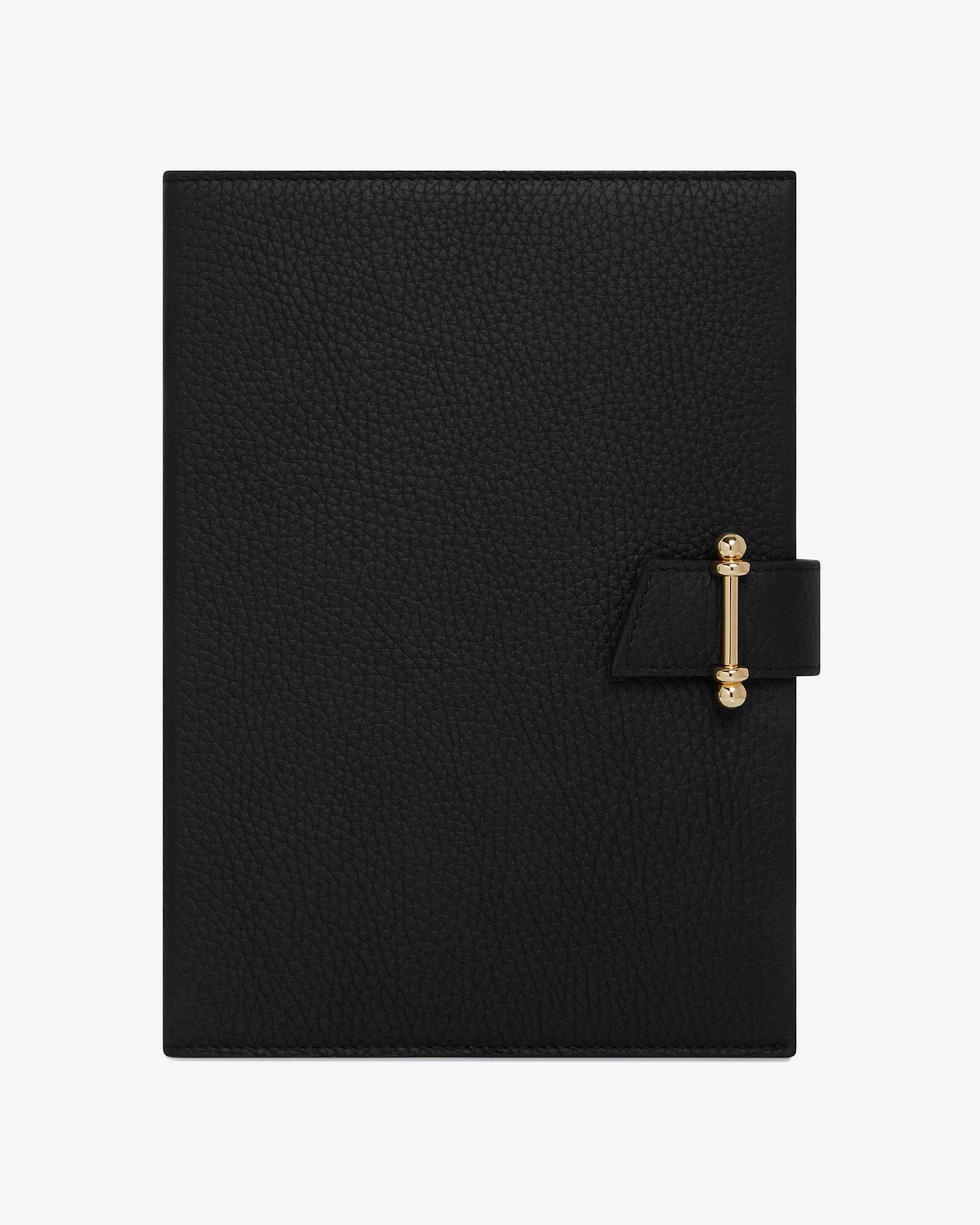 Black leather notebook with gold bar clasp on white background.