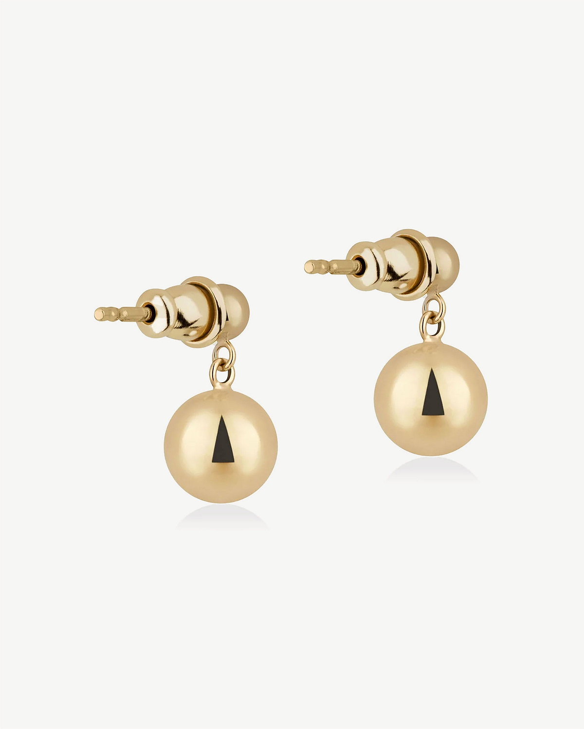 Pair of gold-gilded drop earrings with spherical drops and black triangle detail