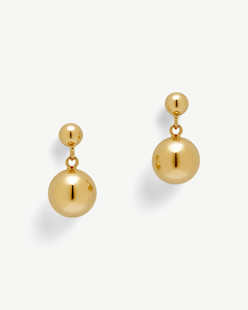Pair of 22 carat gold gilded drop earrings with polished spherical beads.