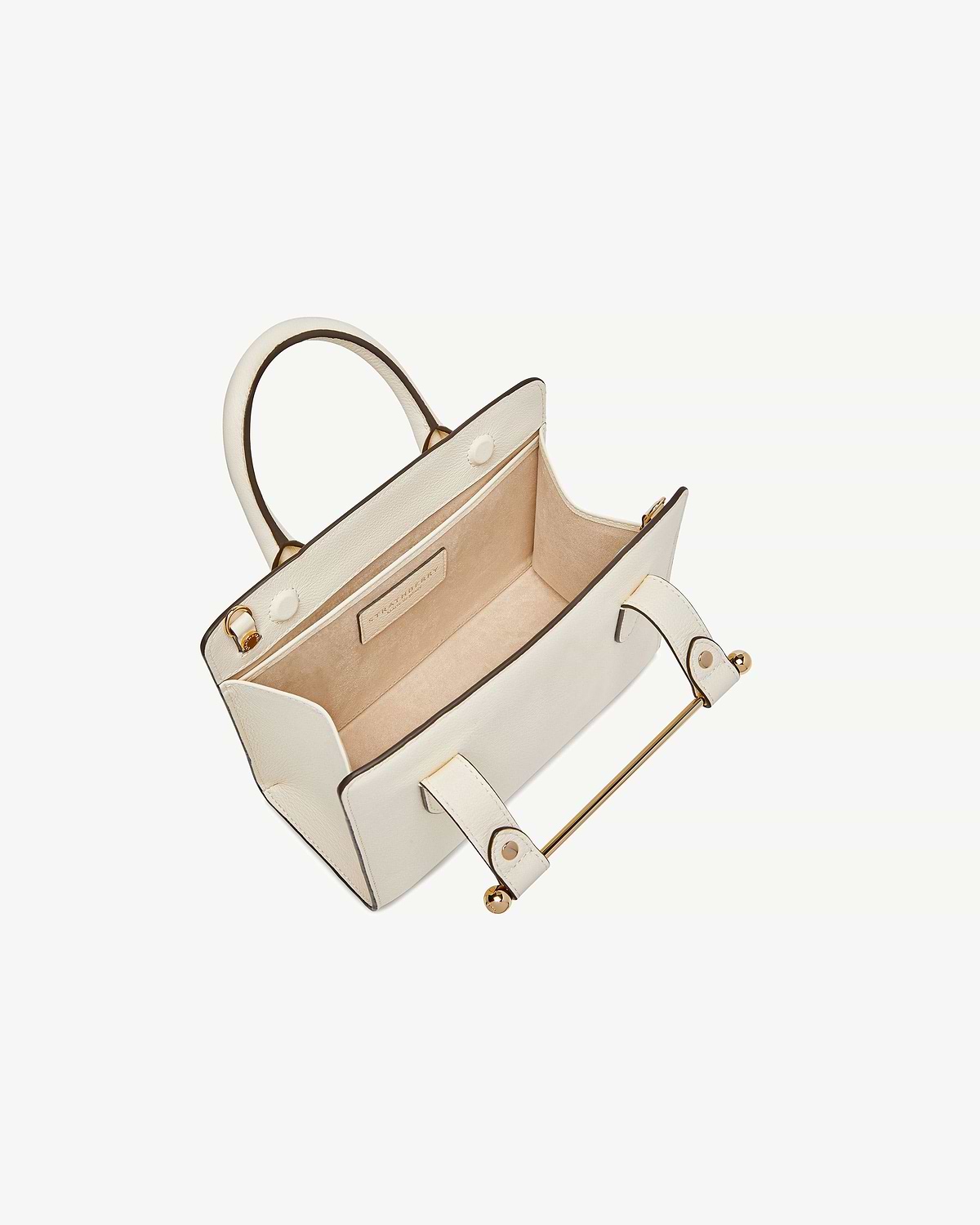 Vanilla mini tote with open interior, suede lining and gold hardware.