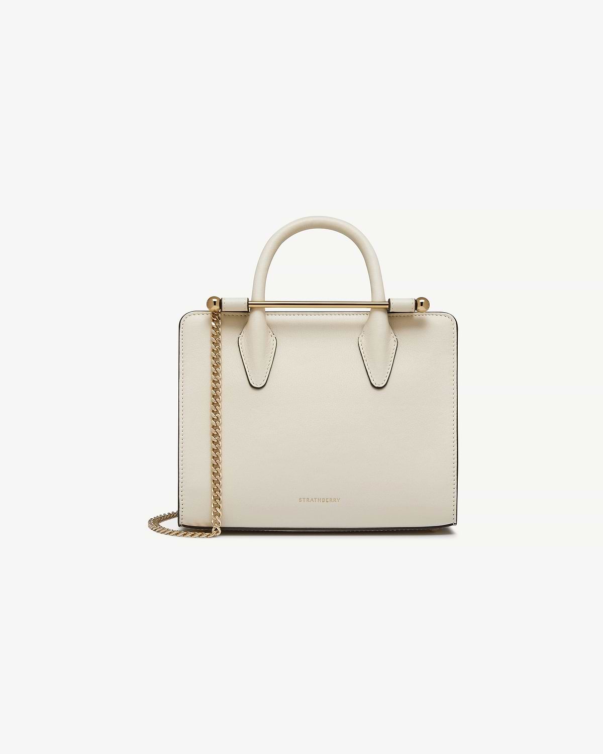 Vanilla mini tote with top handle, gold chain strap and Strathberry logo.
