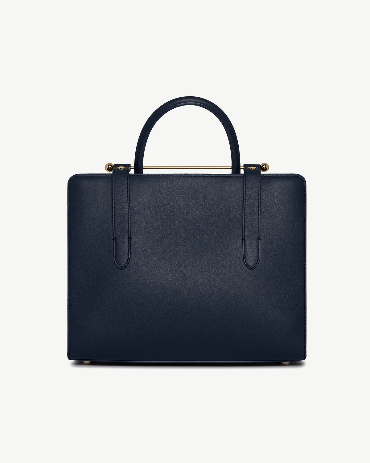 Marine blue midi tote, structured rectangular shape, single top handle, gold bar, metal feet.