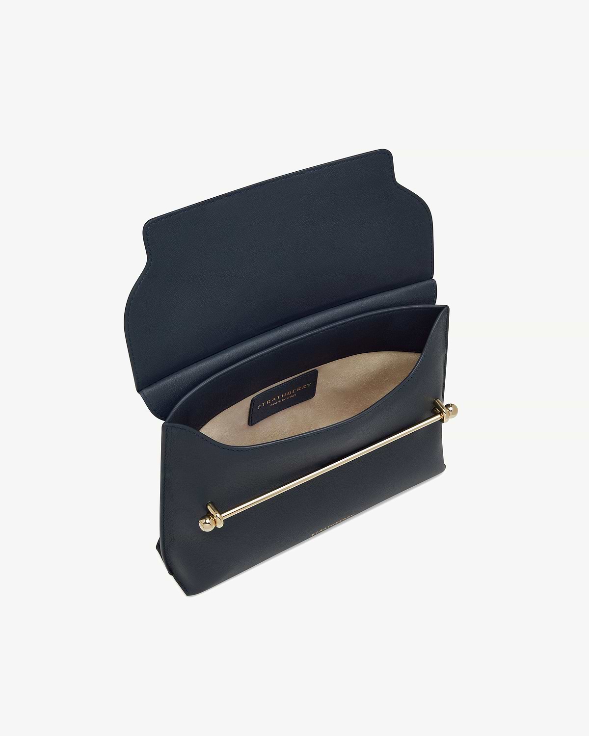 Marine blue Stylist bag with open flap showing Strathberry interior label and gold bar