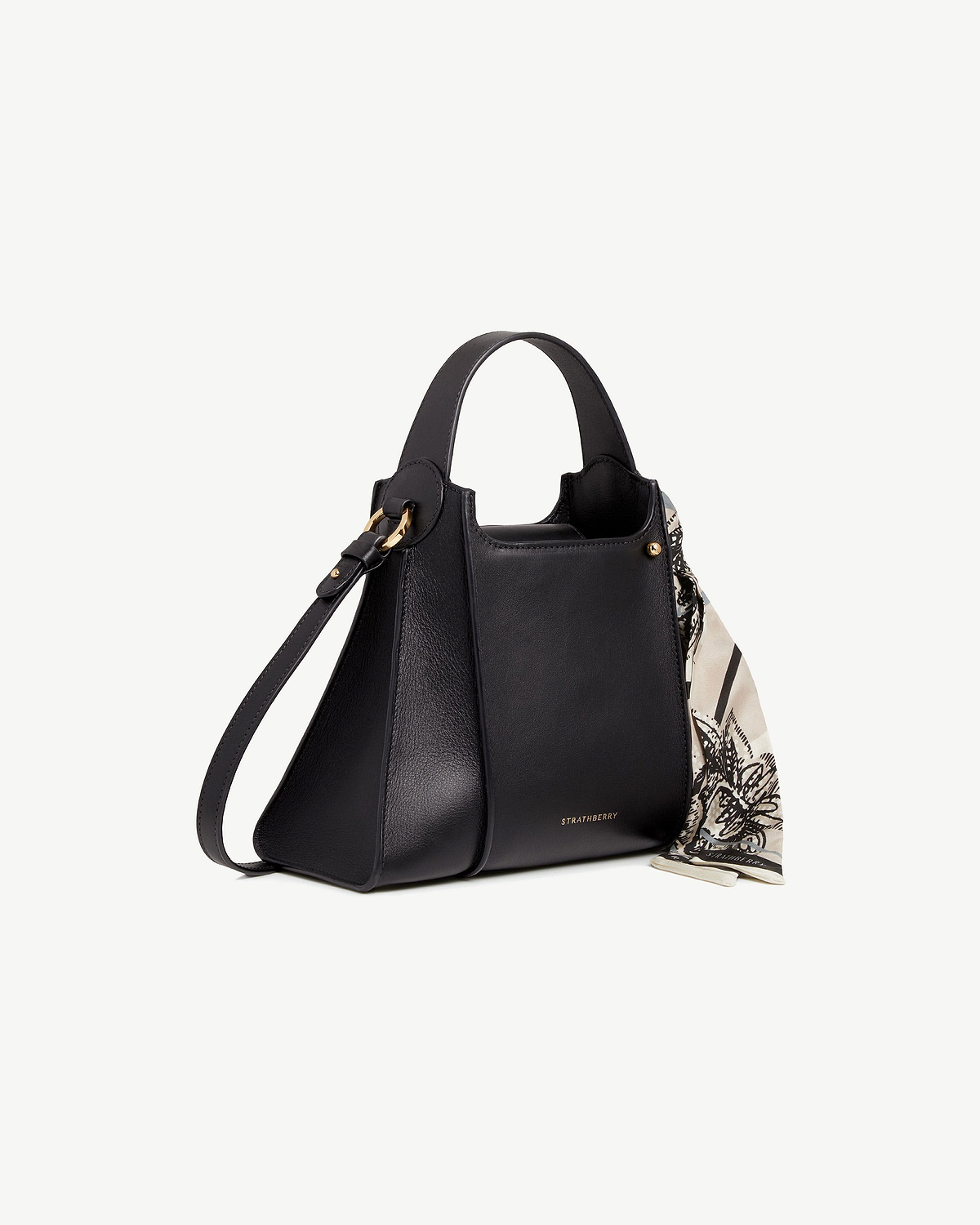 Black Arkshell leather bag with top handle, shoulder strap, gold hardware, Strathberry logo, printed scarf.