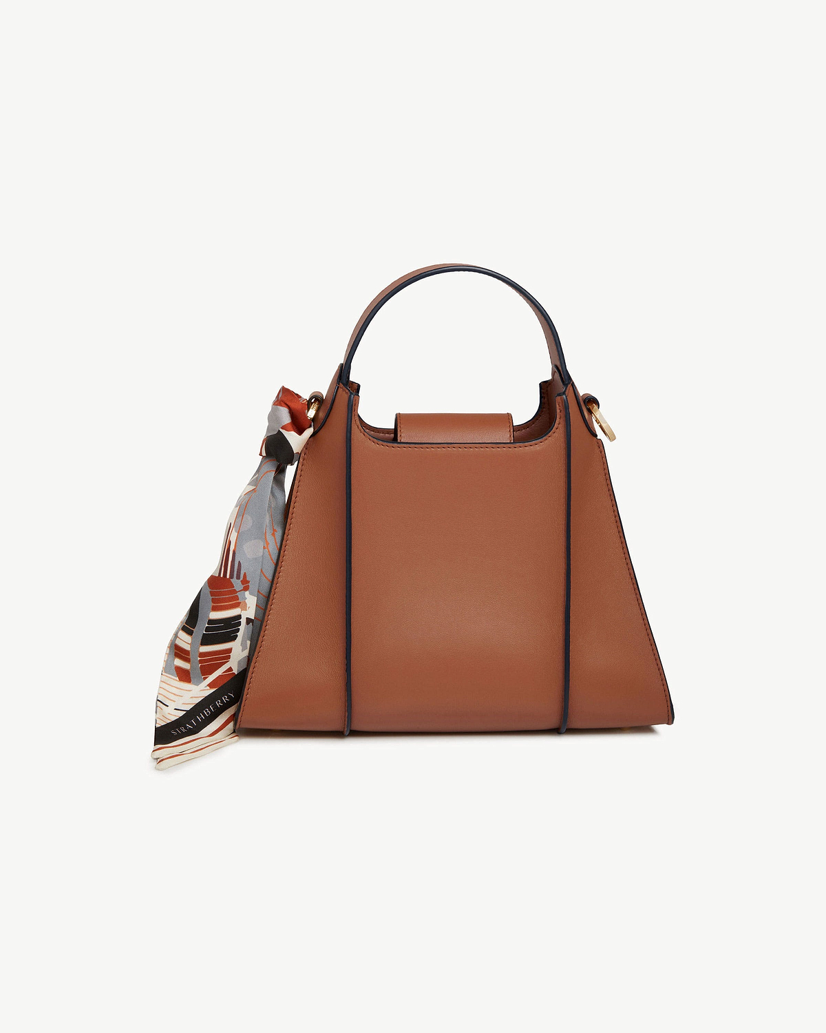Tan Arkshell top-handle handbag with patterned silk scarf tied to side