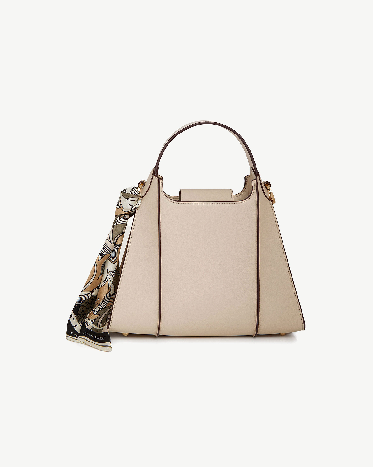 Oat Arkshell handbag with top handle and patterned scarf tied to left handle.