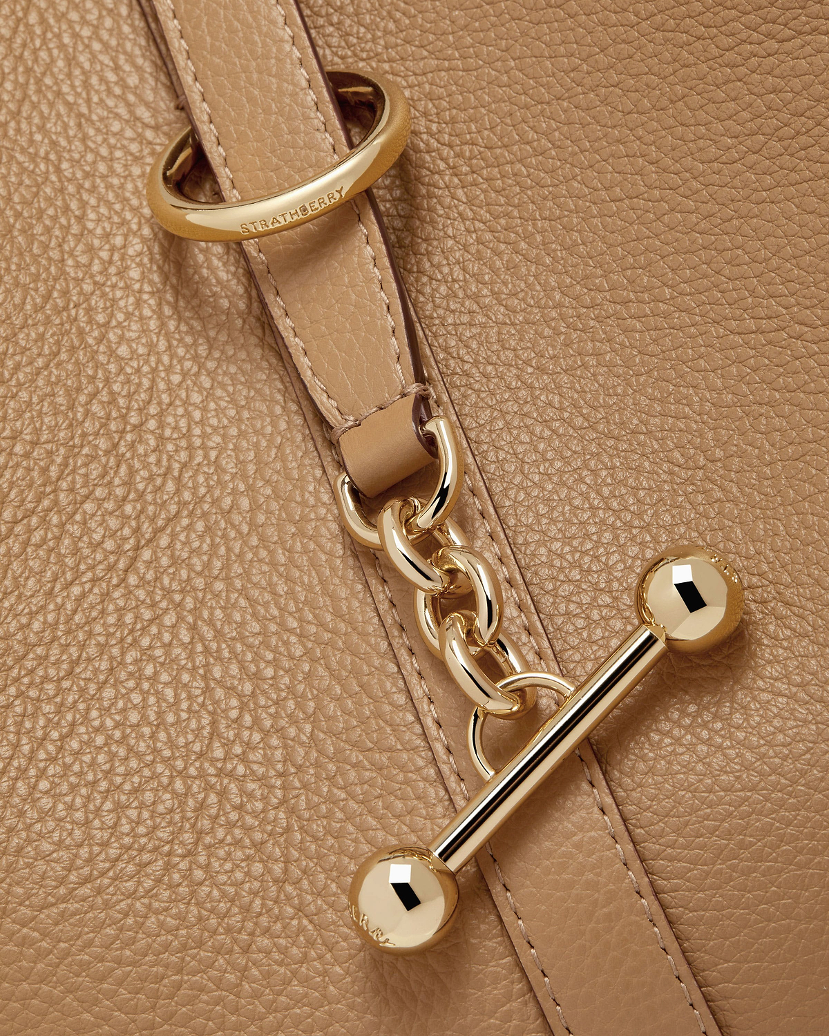 Caramel pebbled leather with Strathberry engraved ring, gold chain and toggle