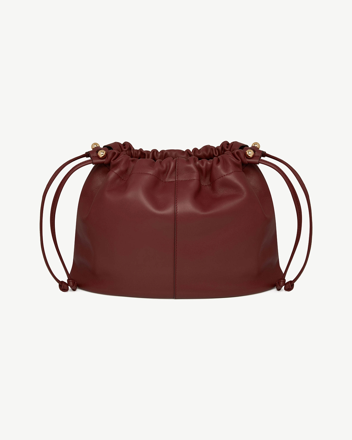 Oxblood leather midi drawstring bag with gathered top and gold-tone hardware.
