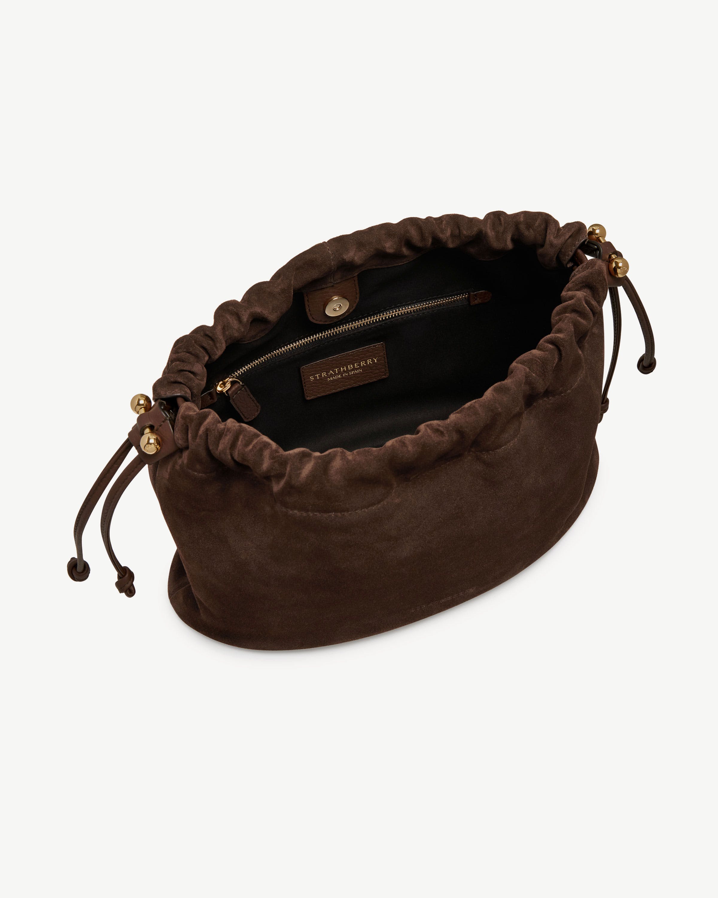 Strathberry chocolate suede drawstring bag with gold bead ends, open top and interior zip pocket.