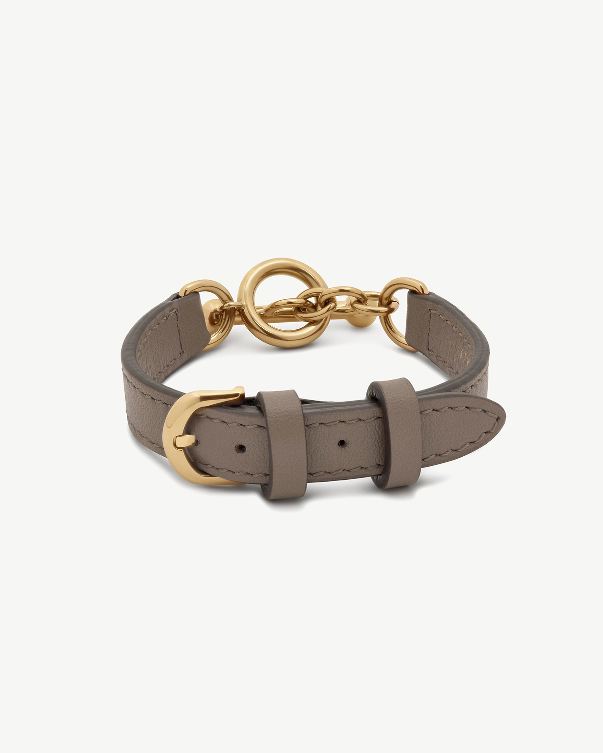 Taupe leather Kite bracelet with gold ring and chain fastening, buckle visible.