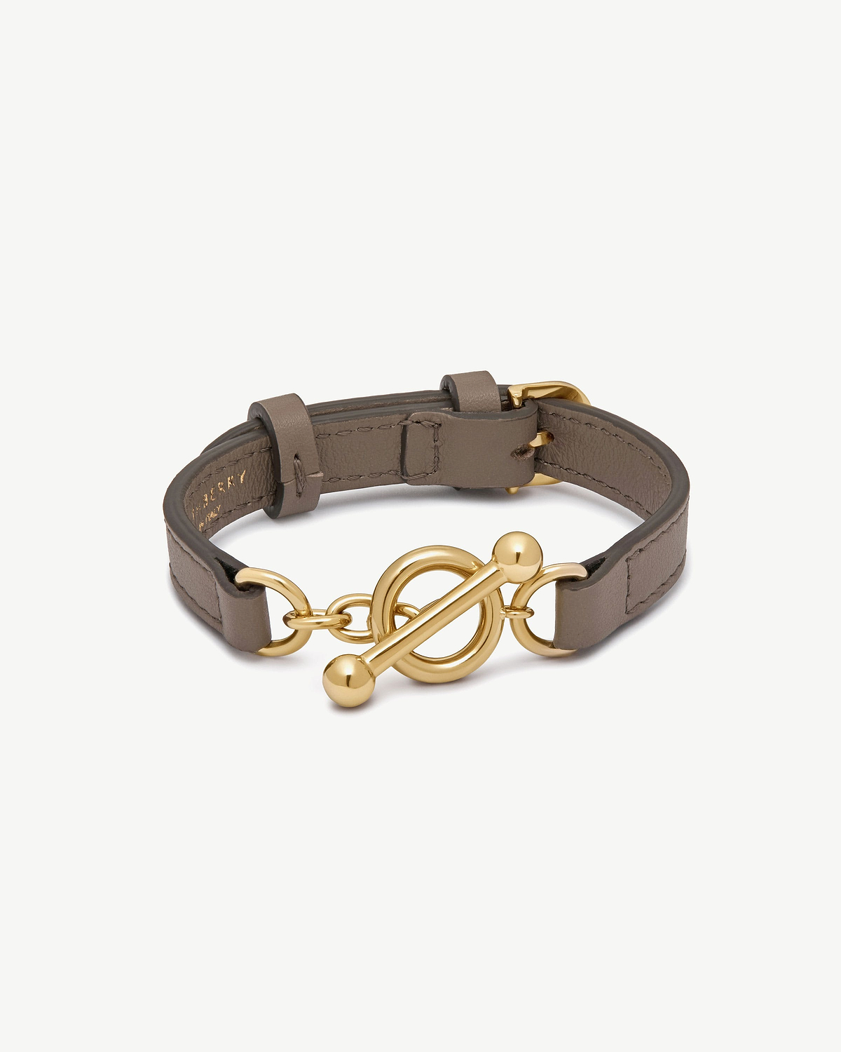 Taupe leather kite bracelet with gold toggle clasp and linked rings.