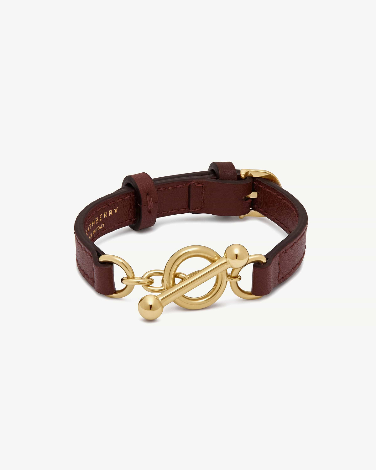 Oxblood leather Kite bracelet with gold toggle clasp, Burberry logo inside.