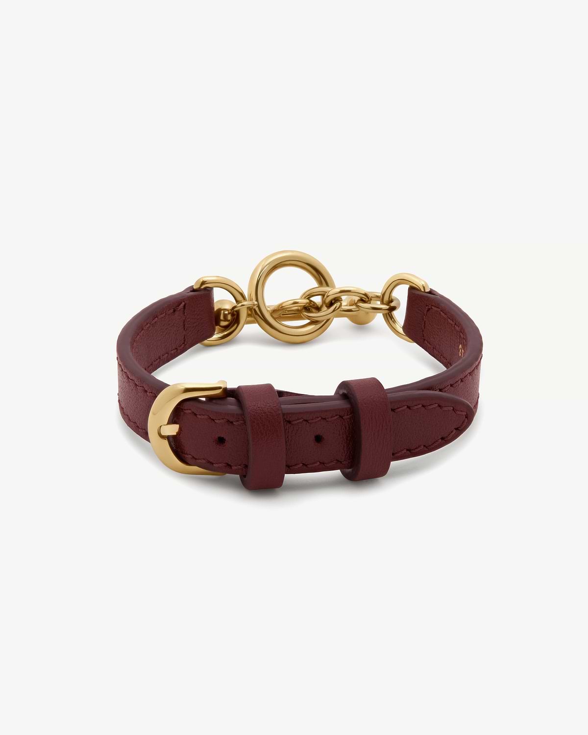 Oxblood leather bracelet with gold circular ring, chain links and buckle hardware.