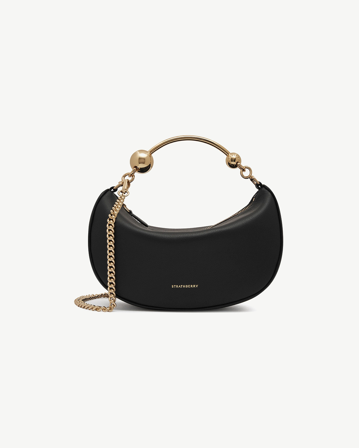 Black Crescent Moon Mini bag with gold chain strap and visible Strathberry logo.