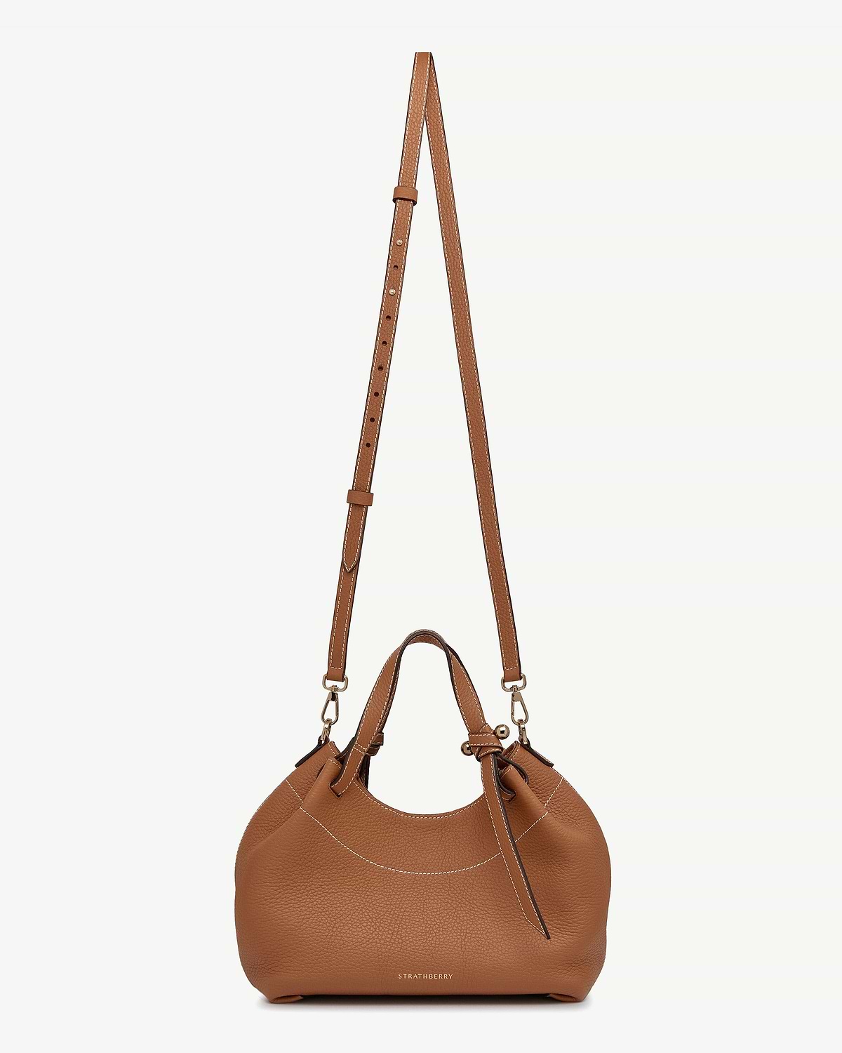 Tan leather Barra Mini bag with top handle, detachable strap, Strathberry logo.