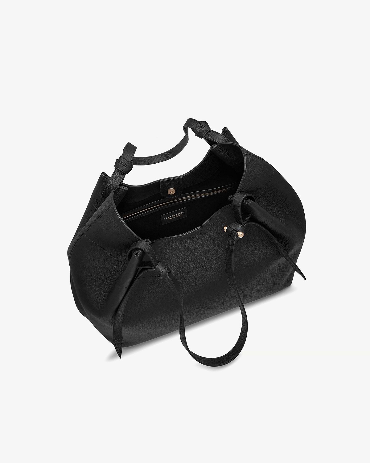 Black Strathberry Barra tote with open top, zip pocket, drawstring and gold studs.