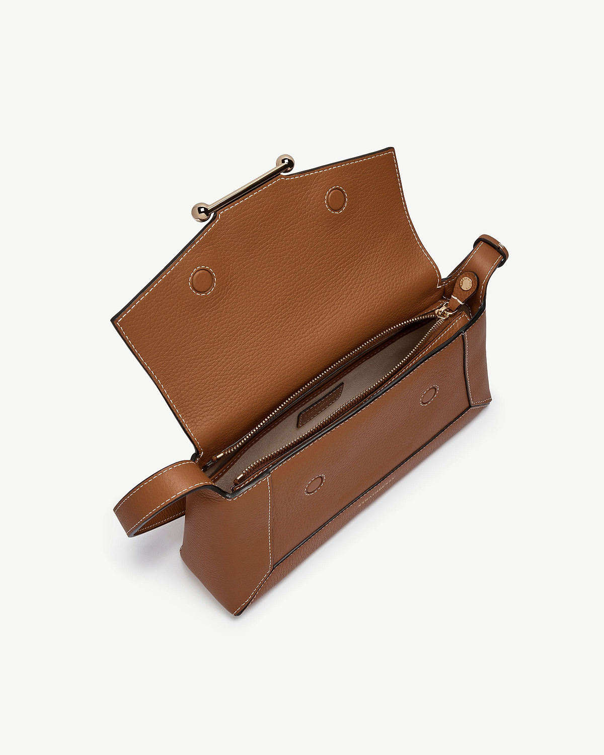 Tan mosaic shoulder bag with open flap, interior zip pocket and white stitching.