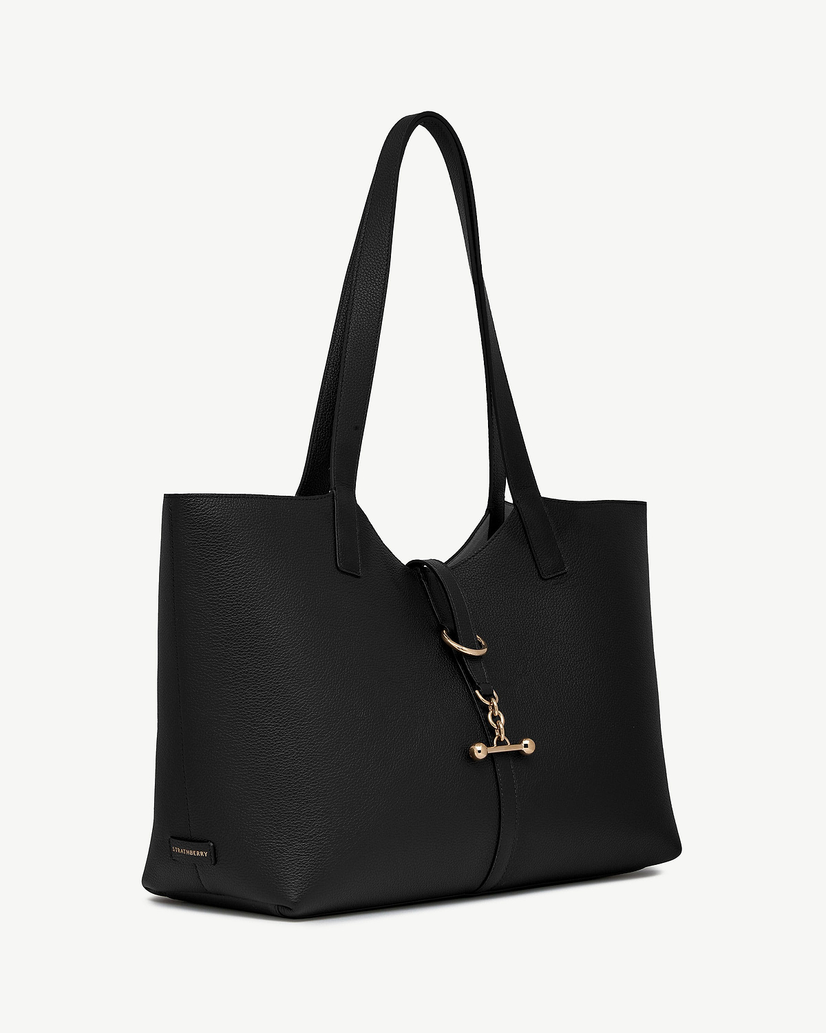 Black kite tote bag with long handles and gold bar fastening, Strathberry logo.