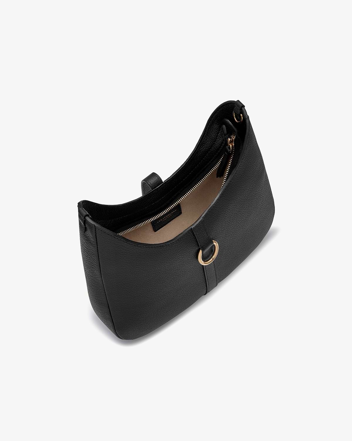 Black Kite Sling bag against white background, pebbled leather with gold ring detail.