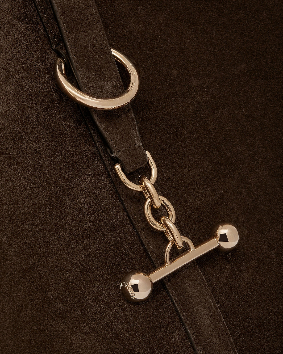 Chocolate suede tote strap with gold chain and bar hardware.