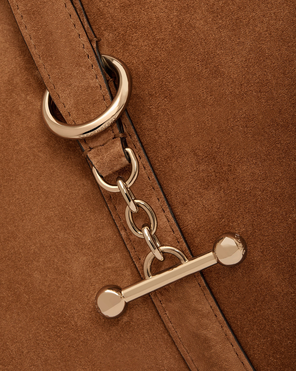 Tan suede Kite Tote Midi showing gold chain hardware and Strathberry ring