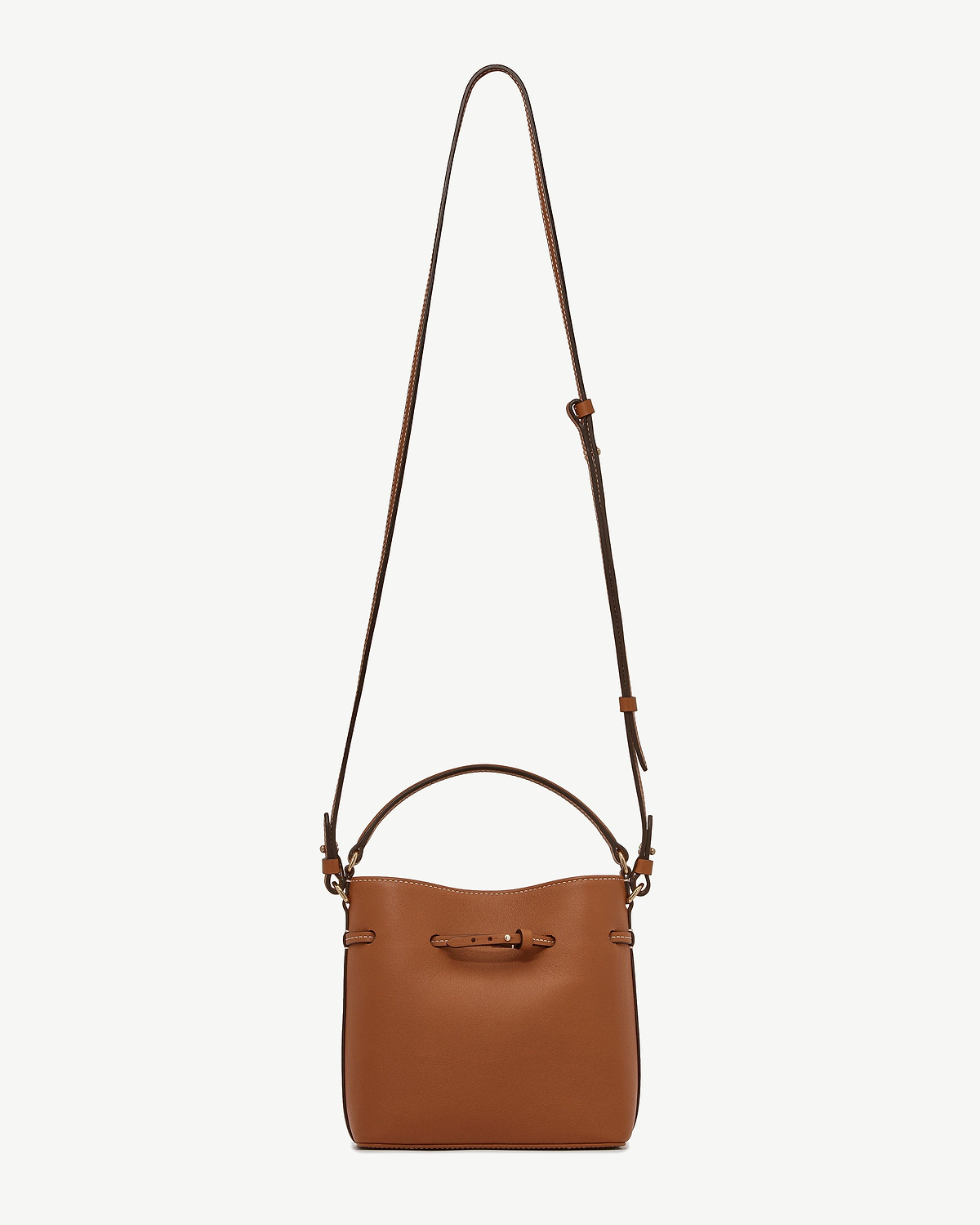 Chestnut leather bucket bag with top handle and long adjustable strap.