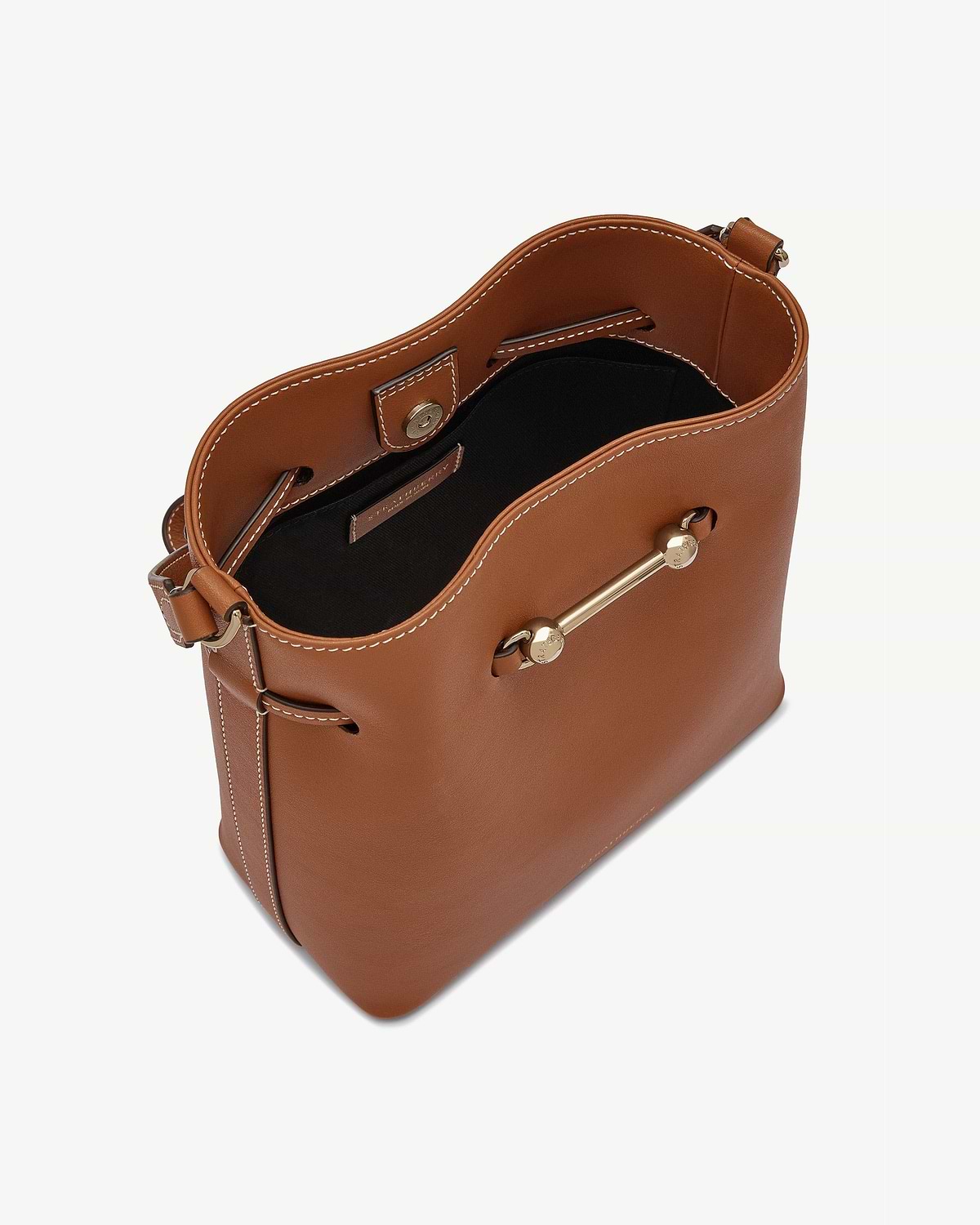 Chestnut leather bucket bag with white topstitching, black lining and gold bar hardware.